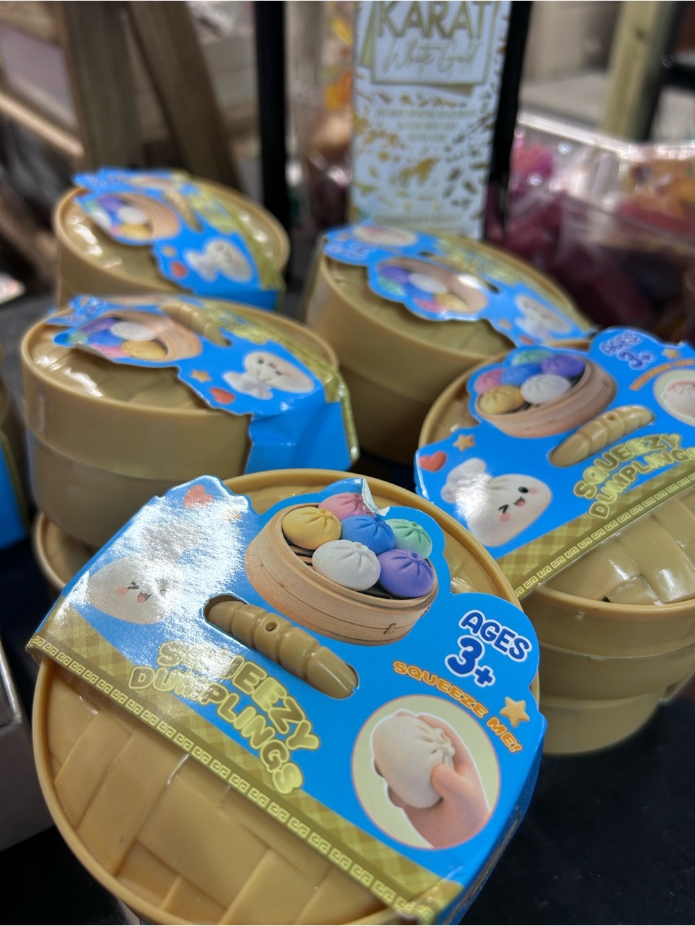 Squishy Dumplings Squeeze Toy - Tan Container with Blue Label